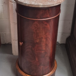 Unusual Empire flame Mahogany cylindrical marble topped bedside/pedestal. Would make an ideal pedestal with added storage inside or could be used as a bedside. Sourced from France and is in good original detailed condition.