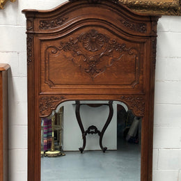 Antique French Oak Louis XV style mantle/trumeau mirror. It has its original mirror and is in good original detailed condition.