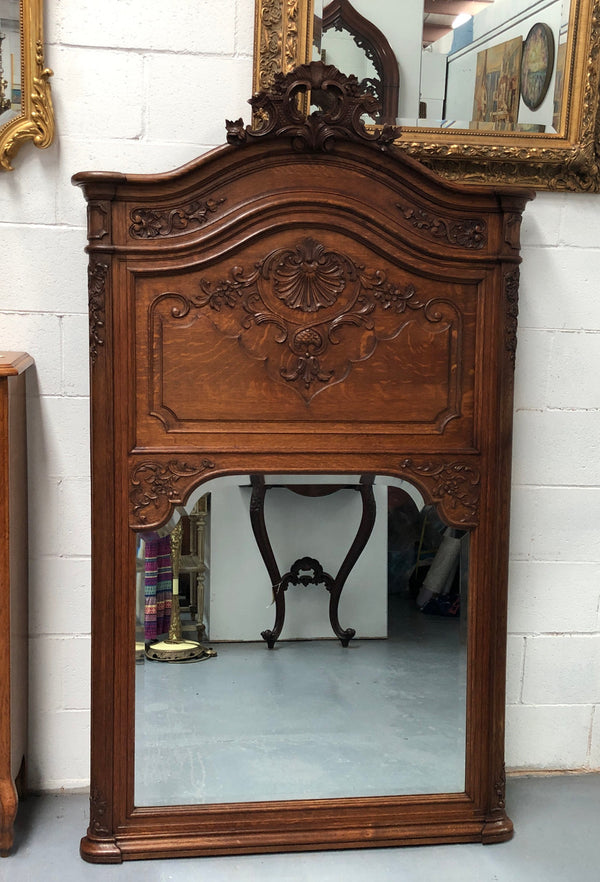 Antique French Oak Louis XV style mantle/trumeau mirror. It has its original mirror and is in good original detailed condition.