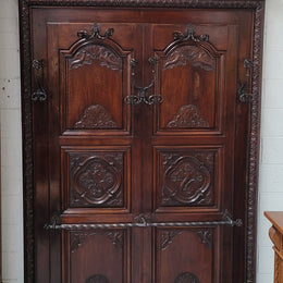 French Henry II 19th century narrow proportioned Walnut hall stand. Full of Character with stunning hand forged wrought iron hooks and interesting carvings. In good original detailed condition.