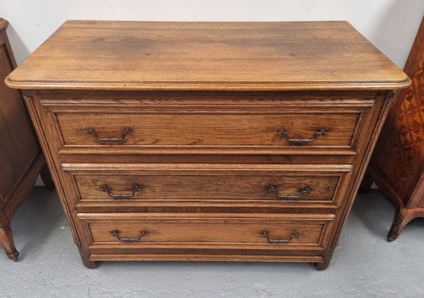 French solid Oak Louis 14th style chest of three drawers. It has three large spacious drawers and it has been sourced from France. It is in good original detailed condition.