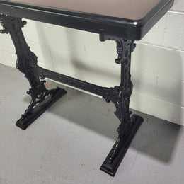 Late Victorian English Mahogany and cast iron base pub table. The foundry maker name is on the base and it is in good original detailed condition.