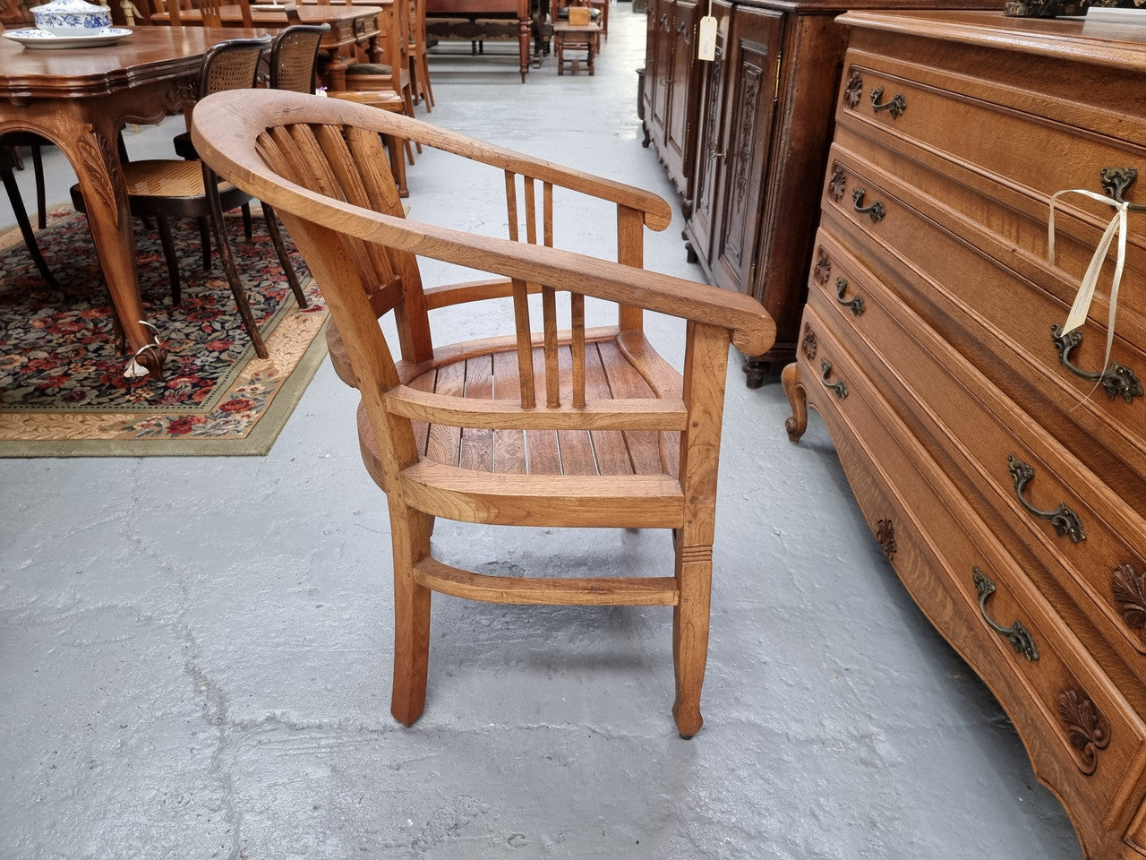 Vintage teak "Captains Chair". It is well built and very comfortable to sit in. It is in good original detailed condition.