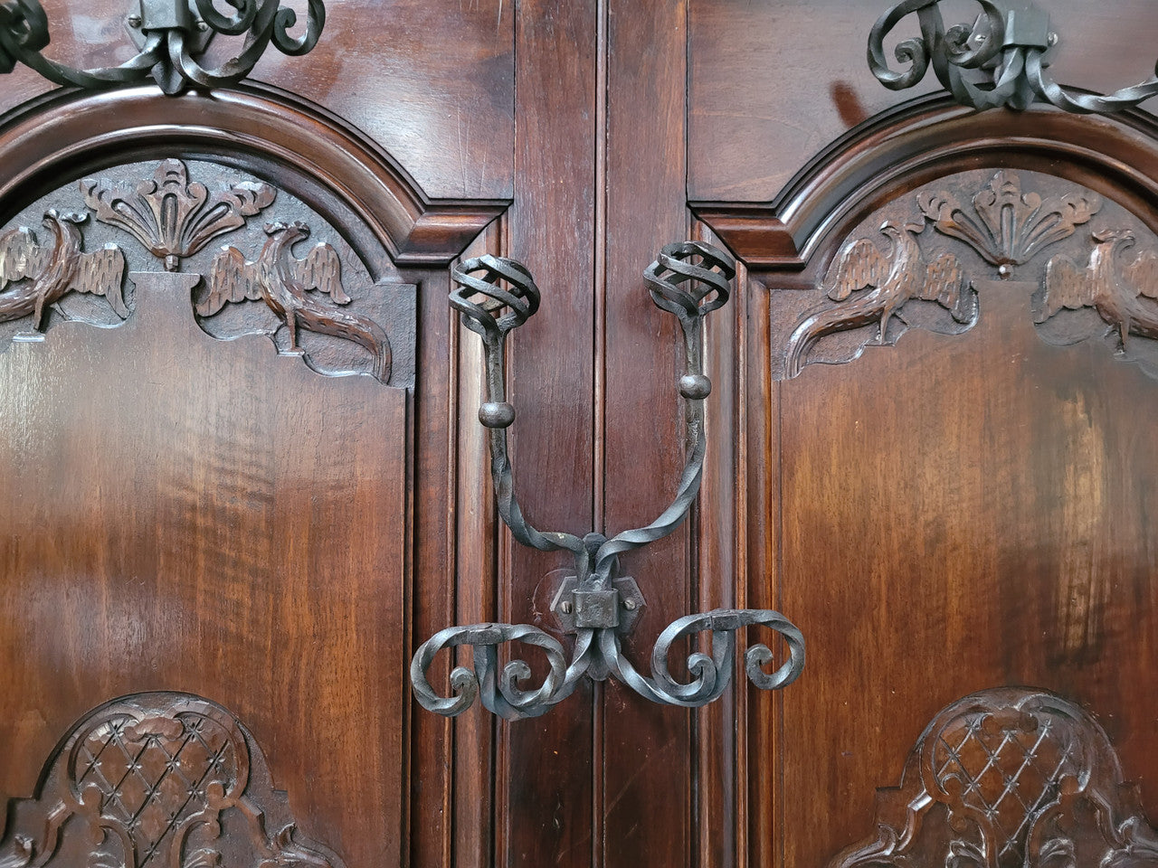 French Henry II 19th century narrow proportioned Walnut hall stand. Full of Character with stunning hand forged wrought iron hooks and interesting carvings. In good original detailed condition.