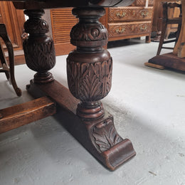 Renaissance style Oak extension table with parquetry top and twin pedestal base. The table extends by pulling out an extension leaf either side making it 287 cm long. Sourced from France and in good original detailed condition.