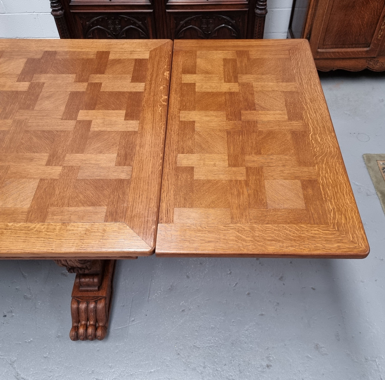 Amazing French Oak Renaissance style parquetry top extension table. Beautiful parquetry top and amazing detailed carvings on the legs. It extends to 306 cm long when fully extended. Sourced from France and in good original detailed condition.