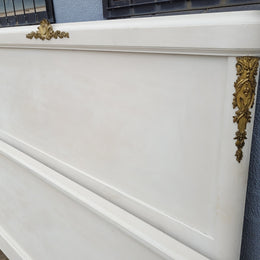 French Louis 16th style chalk painted queen size bed with gilt decorative mounts and includes custom slats. It has been sourced from France and in good original condition.
