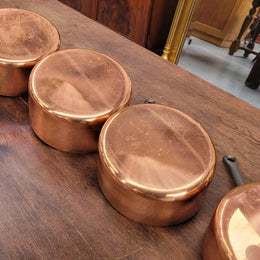 Set of five copper sauce pans with foundry stamp. They have been sourced from France and are in good original detailed condition.