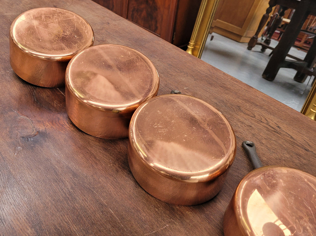 Set of five copper sauce pans with foundry stamp. They have been sourced from France and are in good original detailed condition.