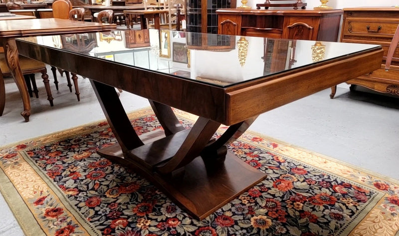 French Art Deco Figured Walnut dining table and six chairs. This stylish table also comes with a glass top and can be used with or without it. The chairs are very comfortable and the table can also fit another two chairs at either end making it a 6-8 seater. The table is in good original detailed condition with character marks to the top of table as shown in the pictures. This table and six chairs have been sourced locally.