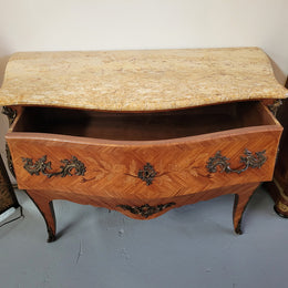 French Louis XV style marquetry inlaid two drawer marble top commode with deorative ormolu trim. In good original detailed condition with working double lock and key.