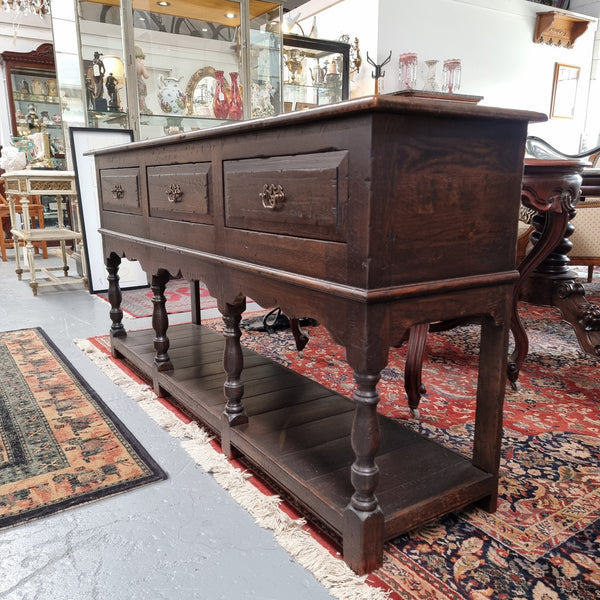 A very hard to find Vintage English kitchen dresser base of narrow proportions, sourced from France. In good original detailed condition.