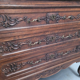 French Oak Louis XV style marble top chest of three drawers. It has beautiful carvings on the drawers with lovely decorative handles all toped with a stunning black and white marble top. In good original detailed condition.