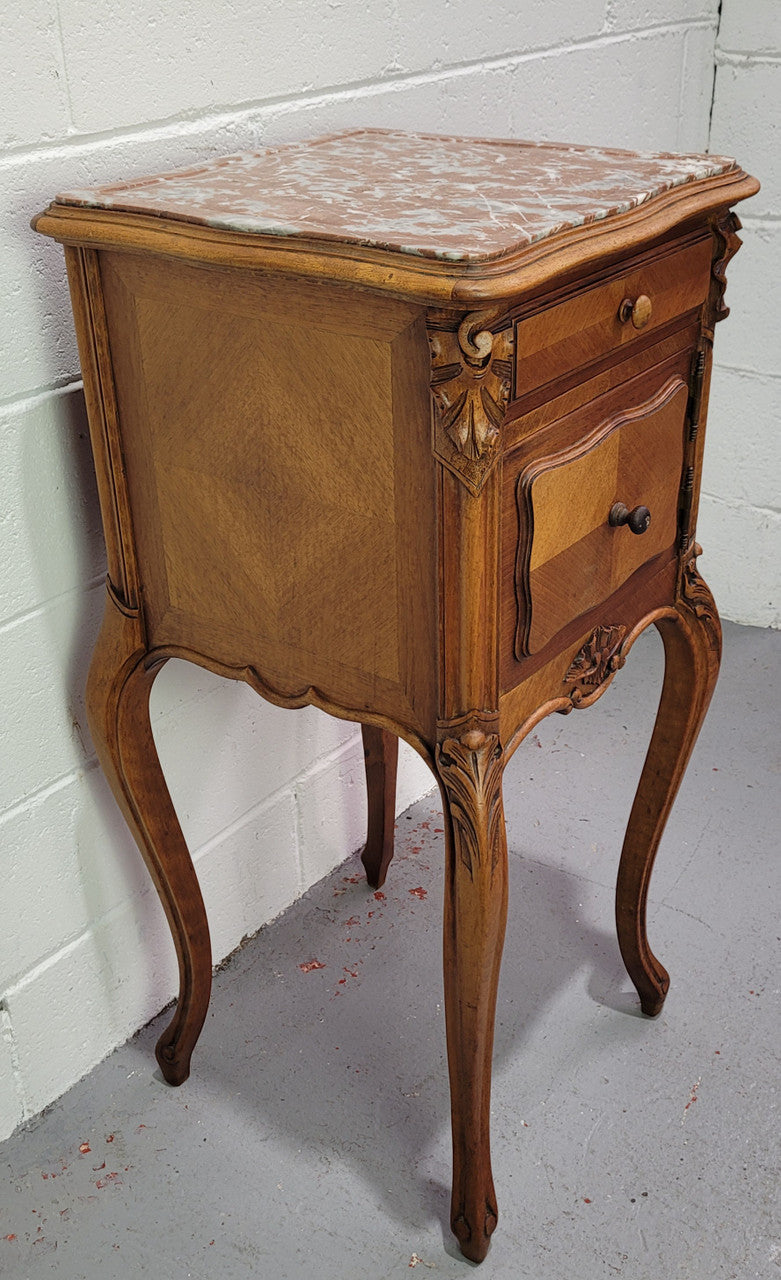Single French Louis XV style Walnut inset marble top bedside. It has one drawer and one cupboard. It is in good original detailed condition.