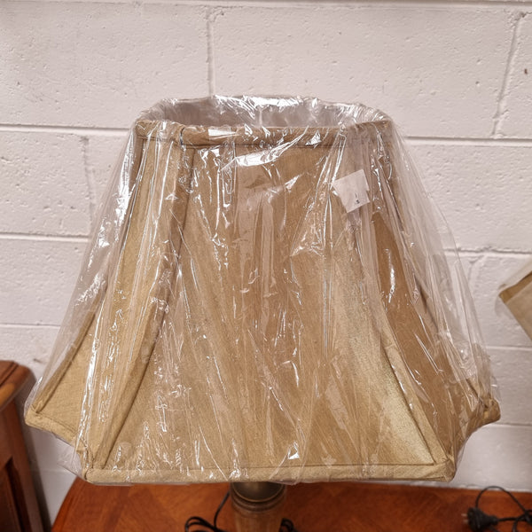 Beautiful pair of metal and glass lamp bases with new gold shades. They are in good original working condition and have been sourced locally.