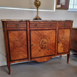 A high quality 19th Century French marquetry inlaid Kingwood marble top credenza. It has an attractive solid marble top and decorative marquetry inlay throughout. It has plenty of storage space with three drawers and three doors. It has been sourced from France and is in good original detailed condition.