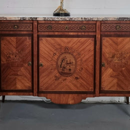 A high quality 19th Century French marquetry inlaid Kingwood marble top credenza. It has an attractive solid marble top and decorative marquetry inlay throughout. It has plenty of storage space with three drawers and three doors. It has been sourced from France and is in good original detailed condition.