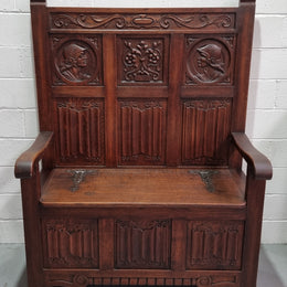 Decorative and nicely carved French Oak 19th Century hall seat with lift up lid for storage. Beautiful details and in good original detailed condition.