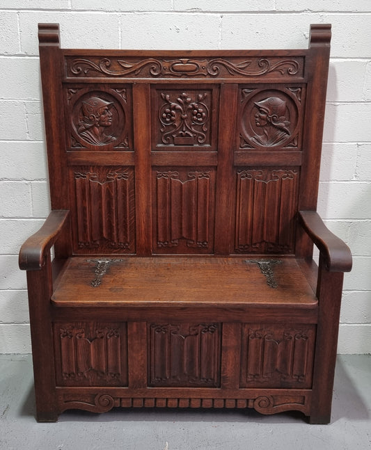Decorative and nicely carved French Oak 19th Century hall seat with lift up lid for storage. Beautiful details and in good original detailed condition.