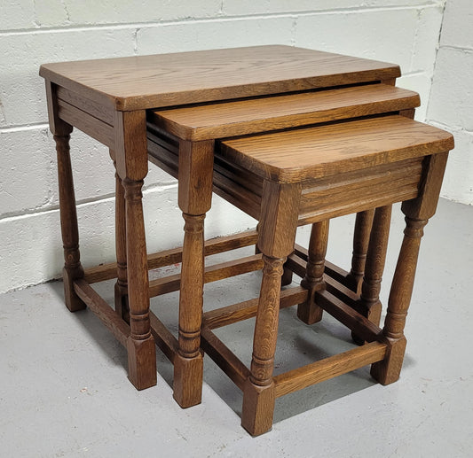 Lovely tudor oak style three nest tables. Circa 1950, In good original detailed condition.