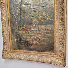 Charming oil painting on canvas depicting a forest scene and deer in an ornate gilt frame. In good original detailed condition.