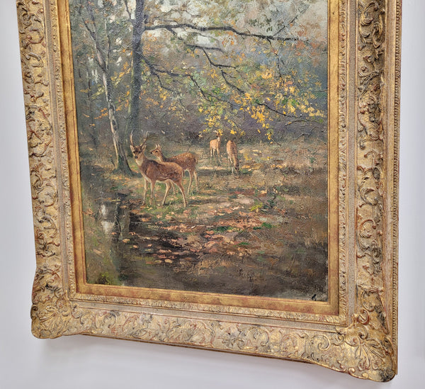 Charming oil painting on canvas depicting a forest scene and deer in an ornate gilt frame. In good original detailed condition.