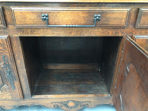 Grand 19th century Oak French kitchen dresser. A beautiful very practical piece with loads of storage havings three large shelves, three large drawers and three shelves for displaying items. It has been sympathetically restored and is in good detailed condition.