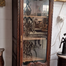 Petite oak armoire display cabinet with a glass door, two drawers at the bottom and three shelves inside. Late 18th Century and amazing detailed decorative carvings. Sourced from France and in good original condition.