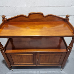 Victorian Mahogany Dumb Waiter with two cupboards, original casters in good detailed condition.