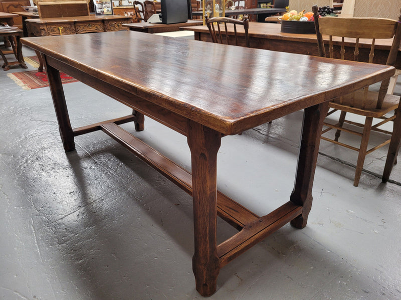 French oak stretcher base refectory table. It has been sourced from France and is in good original condition. Please see pictures to form part of the description.