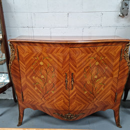A high quality Louis XV style Kingwood marquetry inlay cabinet. Features extensive inlay inside the doors, and has beautiful ormolu mounts. In good original detailed condition.