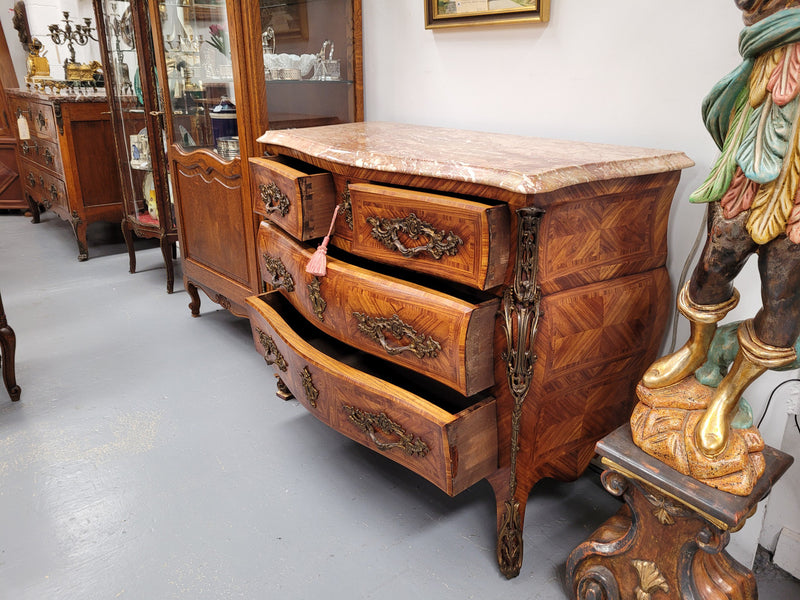 Beautiful French Louis XV style Kingwood inlaid marble top four drawer commode. It has decorative mounts and has been sourced from France. It is in good original detailed condition.