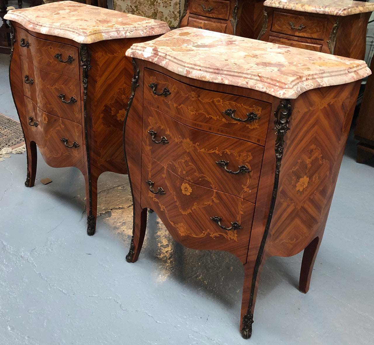 Rare Pair of French miniature commode bedsides with beautiful marquetry inlay & ormolu mount. Circa 1950's and are in very good condition.