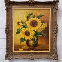 French signed oil on canvas depicting sunflowers in an attractive gilt frame. It is in good original detailed condition and has been sourced from France.