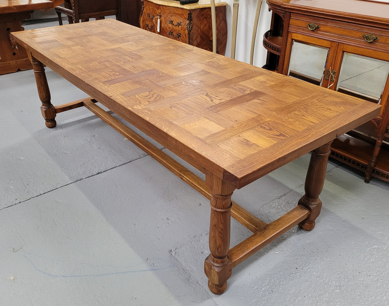 French Oak Refectory dining table with a parquetry top. Sourced from France this table comfortably sits eight to ten. It is in good original detailed condition.