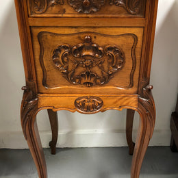 Single French carved bedside with inset marble top. It has beautiful carving and a drawer and cupboard for storage. In very good original detailed condition.