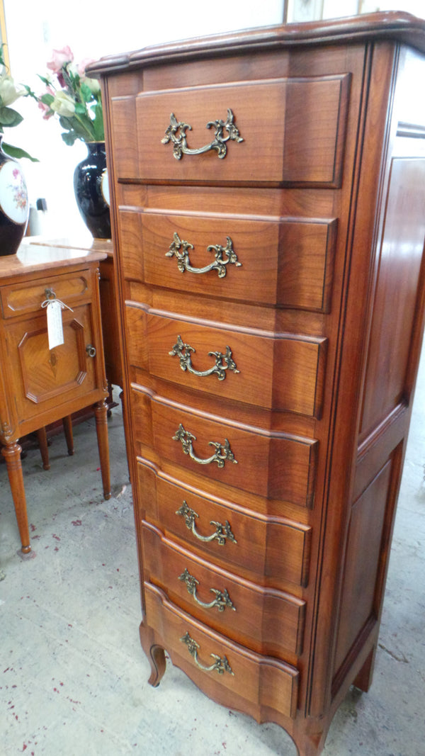 A fabulous petite French Louis XVI style, cherrywood seven drawer semainier. In very good condition.