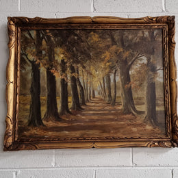 French signed oil on canvas depicting a charming landscape scene in a decorative gilt frame. It is in good original detailed condition and has been sourced from France.