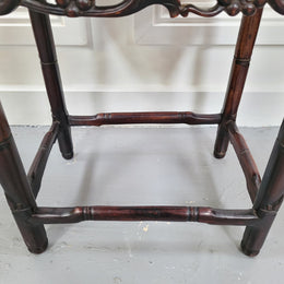 Chinese Rose wood occasional table. Nicely carved and could be used as a coffee table or and occasional table. It is in good original condition.