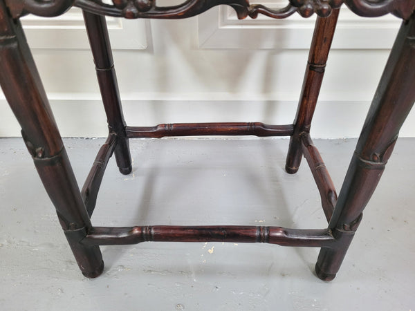 Chinese Rose wood occasional table. Nicely carved and could be used as a coffee table or and occasional table. It is in good original condition.