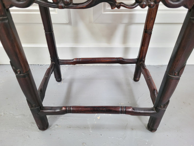 Chinese Rose wood occasional table. Nicely carved and could be used as a coffee table or and occasional table. It is in good original condition.
