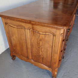 Beautifully carved french oak, faux partners desk with a lovely parquetry top and 6 drawers and 1 cupboard . In good original condition.
