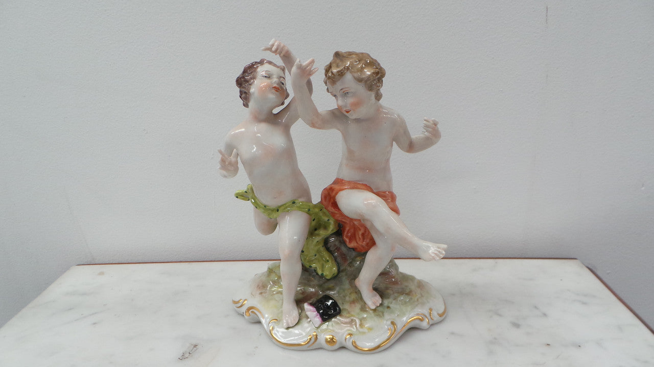 Lovely porcelain 19th century Figurines from the Naples factory. It is in good condition with only slight damage to one finger.