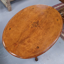 Victorian Walnut oval beautifully inlaid occasional table with bird cage undercarriage. It is in good original detailed condition and it has been sourced locally.