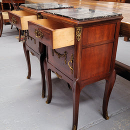 Appealing Louis XV style high quality bedside cabinets with black Portoro marble top and bronze mounts. They have been sourced from France and are in good original condition.