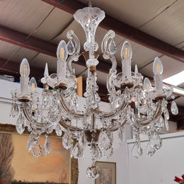Sourced From France an attractive eight arm French crystal chandelier. It has been fully rewired to Australian standards and is in good original working condition.