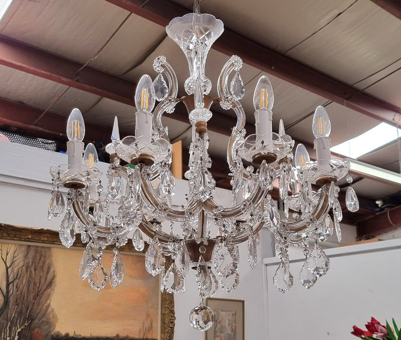 Sourced From France an attractive eight arm French crystal chandelier. It has been fully rewired to Australian standards and is in good original working condition.