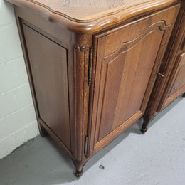 French Louis XV style parquetry top three door sideboard with two drawers. Plenty of storage space with a shelf behind each door. It is in good original detailed condition.