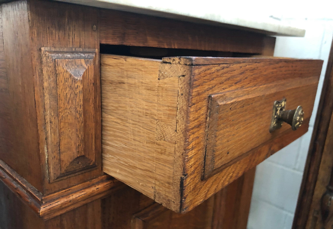 A lovely pair of French Oak, marble top bedside cabinets with a cupboard and drawer in good original condition.
