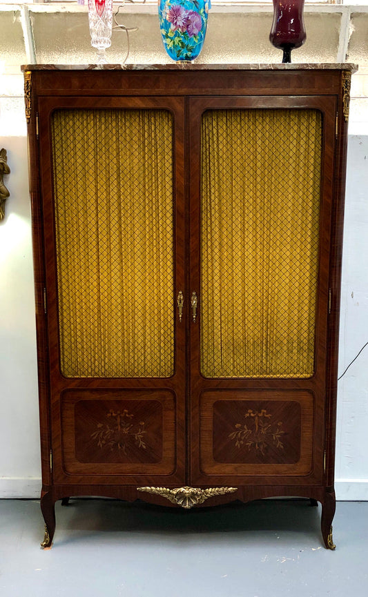 Beautiful 19th Century French Louis XV style Mahogany Blind Bookcase. This piece has lovely inlaid doors and ormolu mounts, marble top and four adjustable shelves. In good original detailed condition.